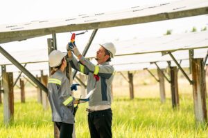 Engineer hand is installing and checking an operation of sun and cleanliness of photovoltaic solar panels, Engineer with energy measurement tool photovoltaic modules for renewable energy